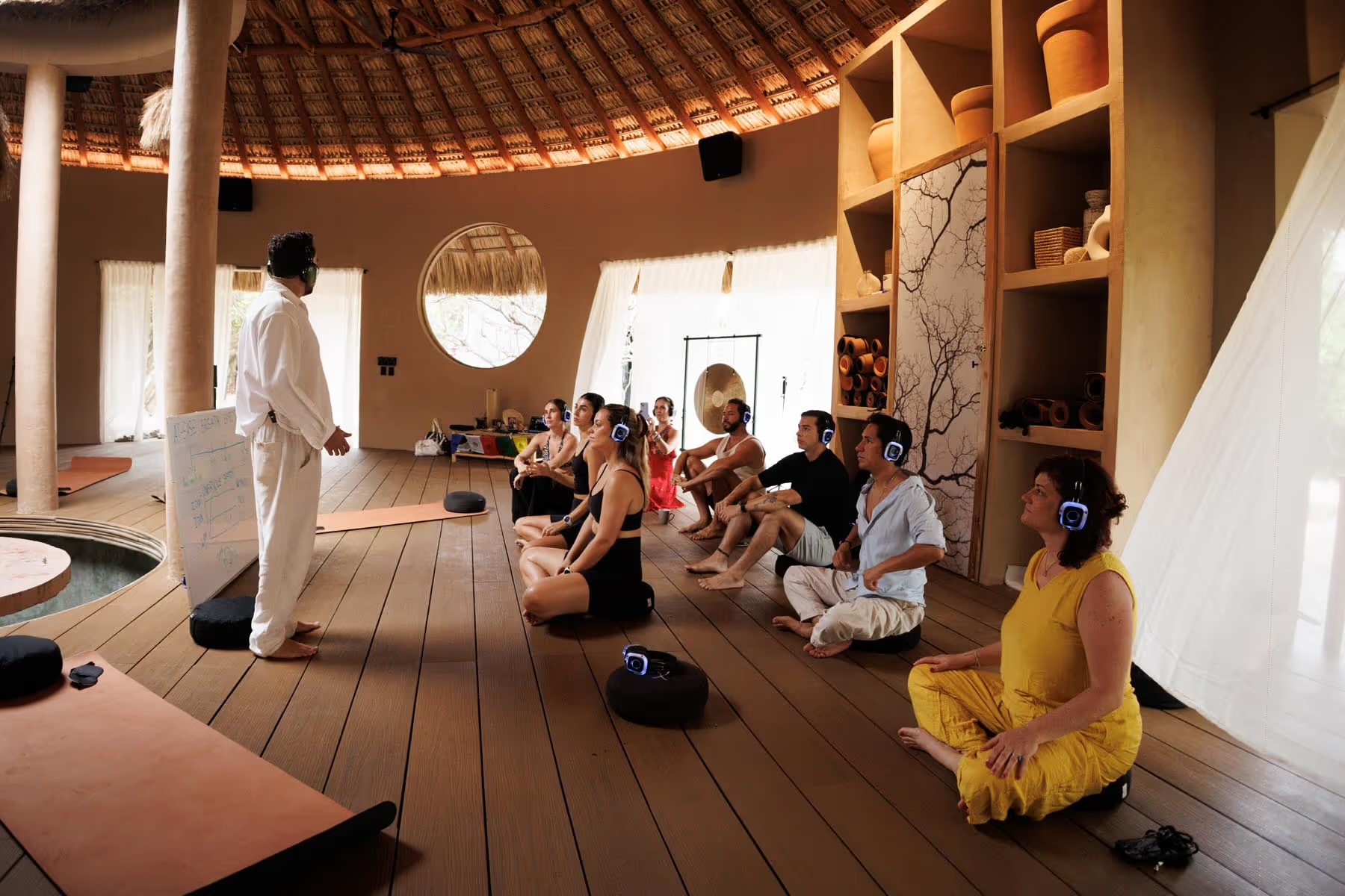A group seated in the Yoga Shala